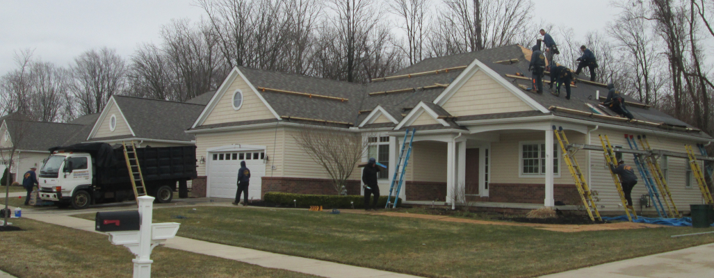 Daugherty Construction workers replacing a roof in Mentor Ohio